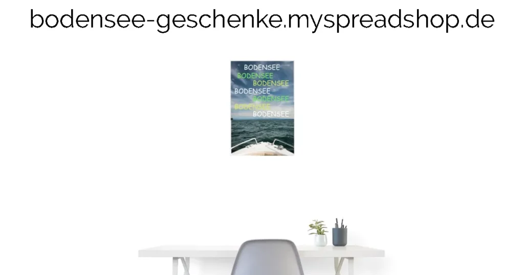 Oben steht die Webadresse: bodensee-geschenke.myspreadshop.de Eine neutrale Wand mit einem Poster mit den Wort 
